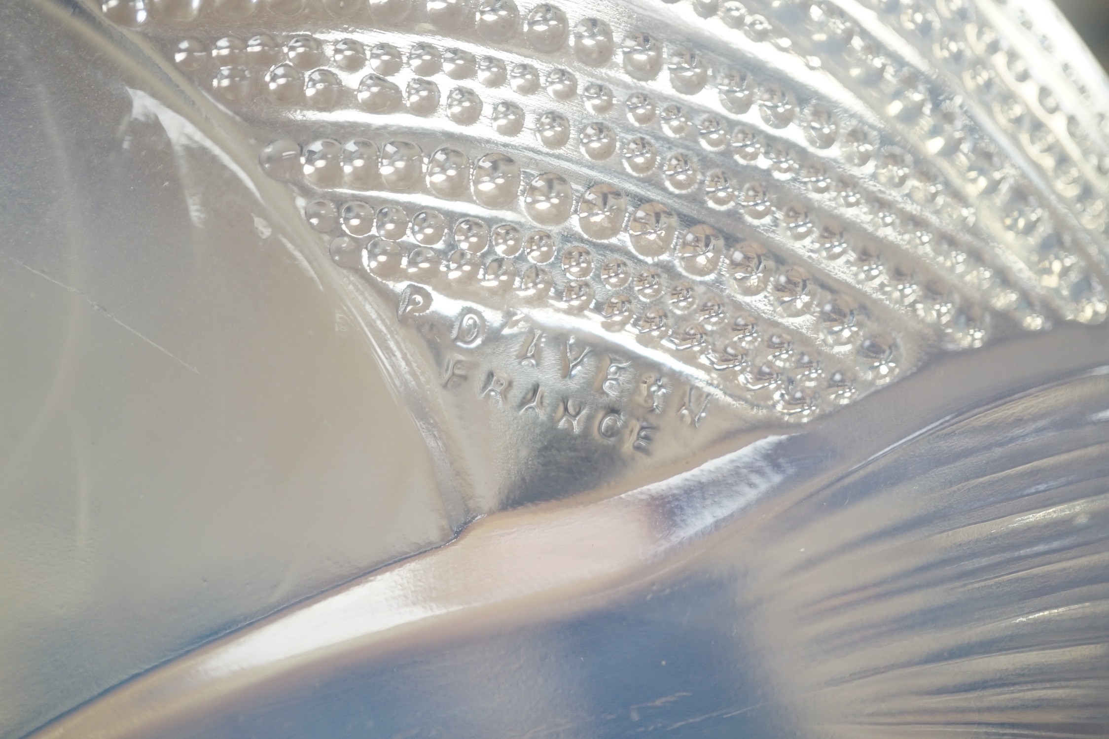 Pierre D'Avesn - a Lalique style opalescent glass dish, moulded in relief with three carp among waves, 30cm diameter